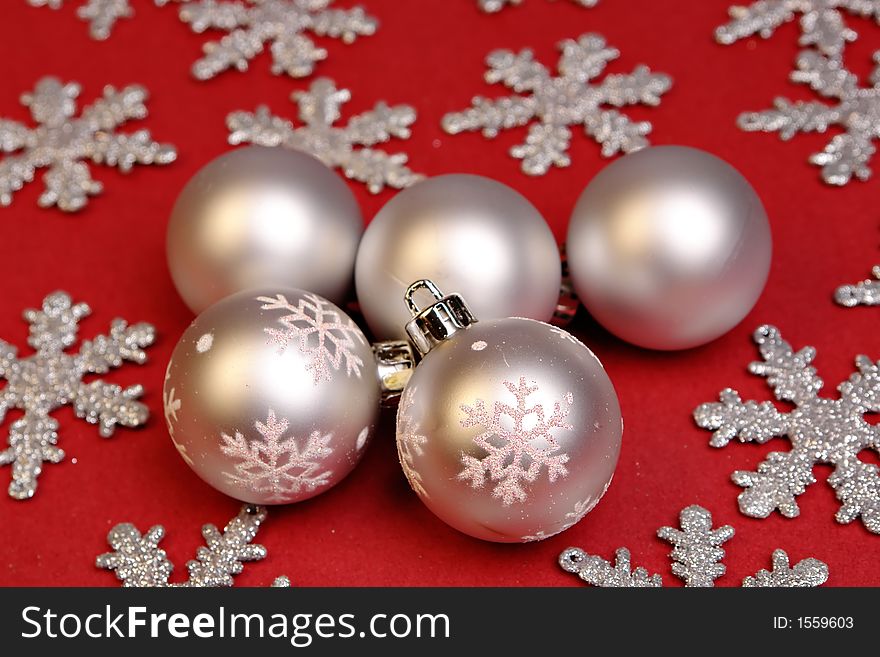 Silver christmas ornaments on red. Silver christmas ornaments on red