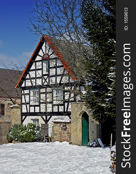 Half-timbered house in the snow somewhere in southern Germany. Half-timbered house in the snow somewhere in southern Germany