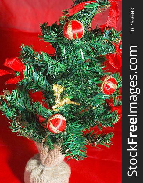 Christmas tree with balls in a red background. Christmas tree with balls in a red background