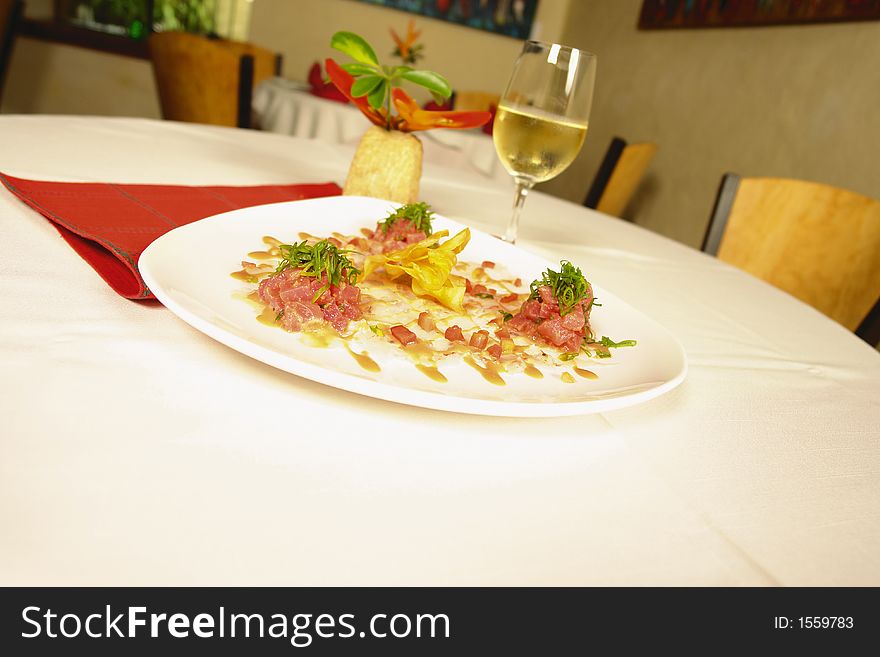 Italian appetizer from shirmp and octupus served with white wine in a restaurant