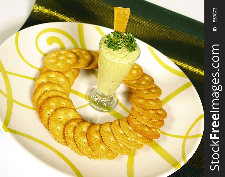 Guacomole from avocados served with round crackers. Guacomole from avocados served with round crackers