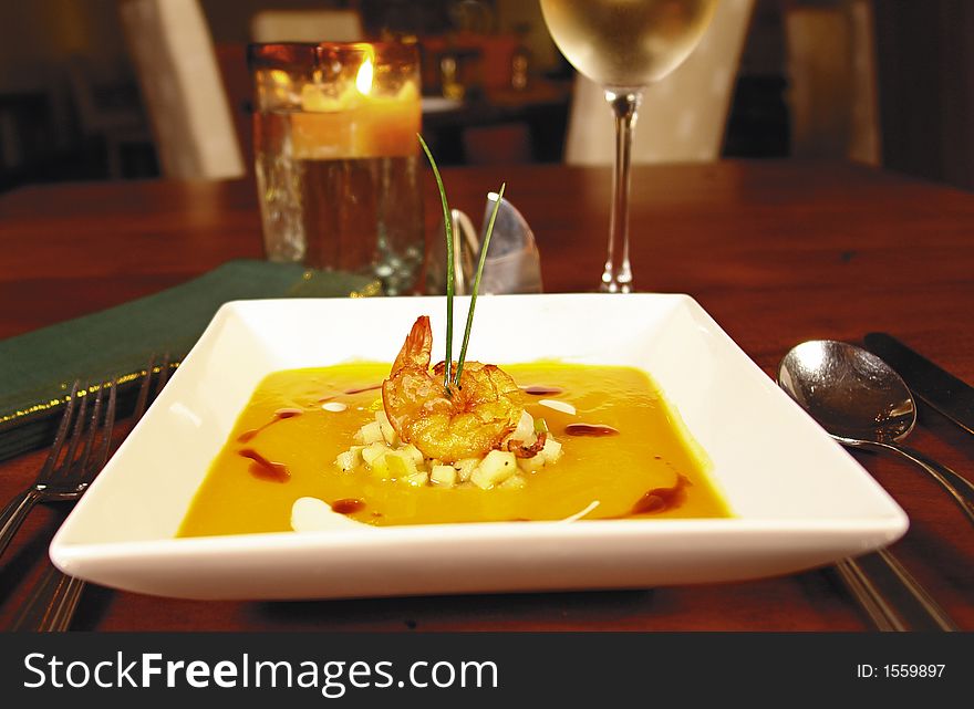 Soup with shrimp served gourmet style in a restaurant