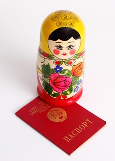 Russian Nesting Doll Standing On USSR Passport Stock Photography Russian Nesting Doll Standing On USSR Passport Stock Photography