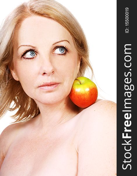 A beautiful middle aged woman with an apple on her shoulder. A beautiful middle aged woman with an apple on her shoulder.