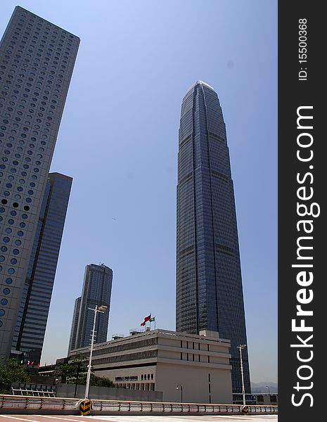 IFC 2 on the right and Jardine House on the left, with round windows, two landmark business buildings in downtown Hong Kong. IFC 2 on the right and Jardine House on the left, with round windows, two landmark business buildings in downtown Hong Kong
