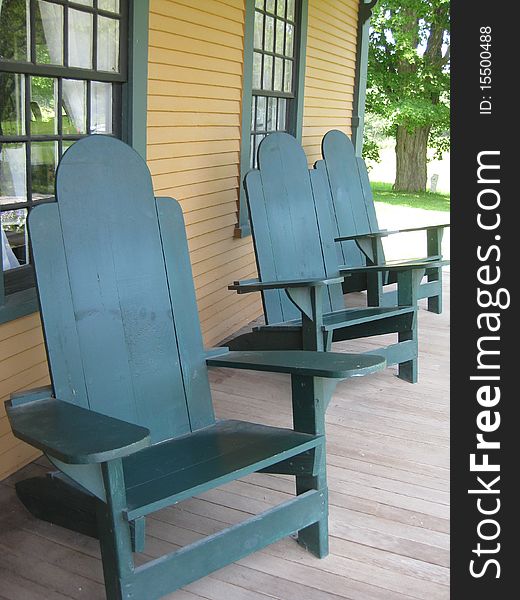 Chairs lined up along a porch are an inviting
offer to sit and visit. Chairs lined up along a porch are an inviting
offer to sit and visit.