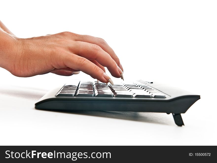 Female hands taping on black pc keyboard. White background. Female hands taping on black pc keyboard. White background