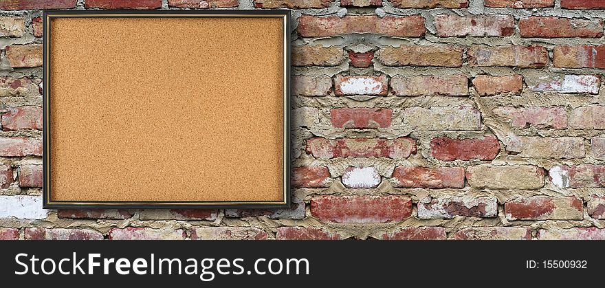 Empty cork board on broken brick wall. Empty cork board on broken brick wall.