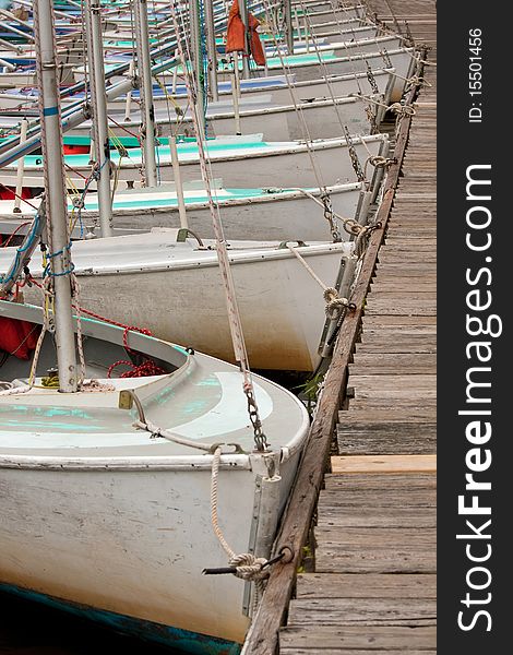 Row of boats in a harbor.