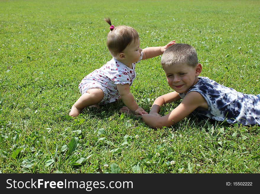 Children play on a grass