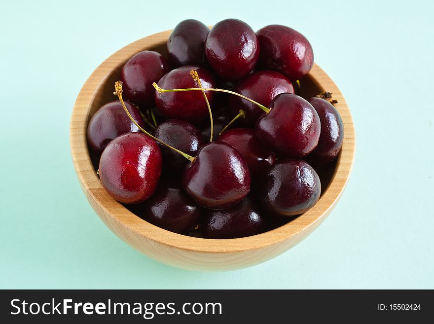 Cherries In A Wooden Bowl