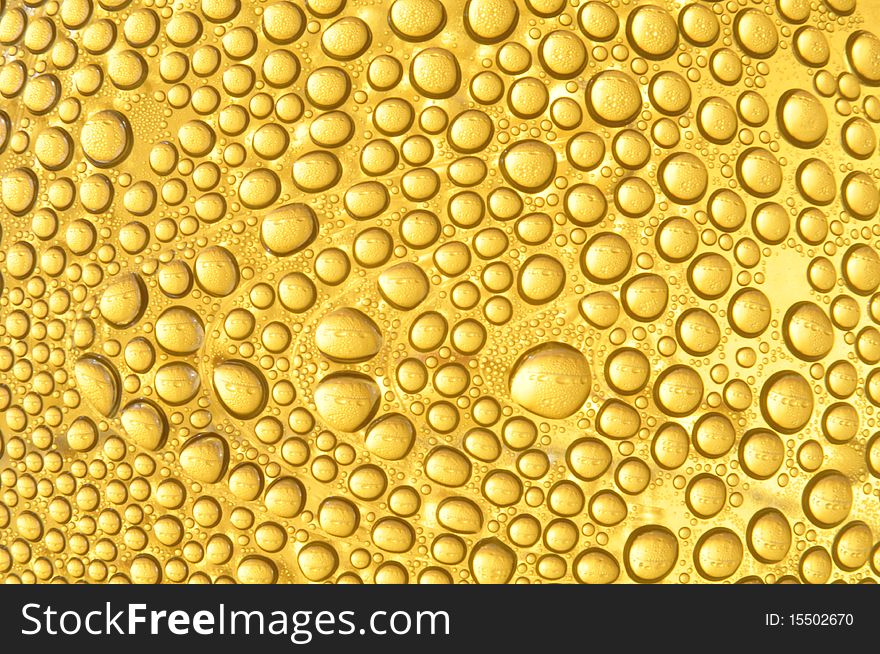 Water droplet in yellow color background texture