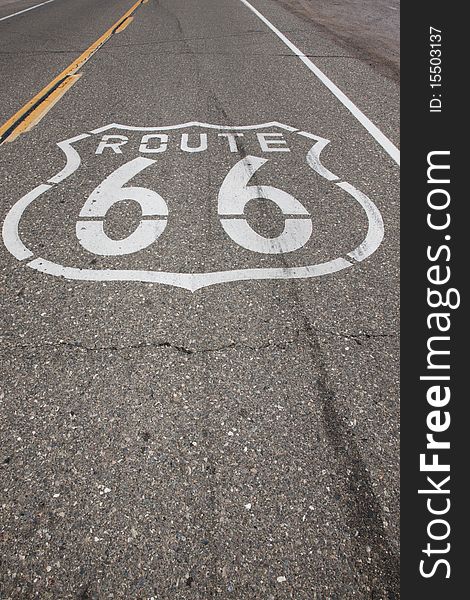A sign reading Route 66 is stenciled on the highway on a stretch of road that was once Route 66. A sign reading Route 66 is stenciled on the highway on a stretch of road that was once Route 66.