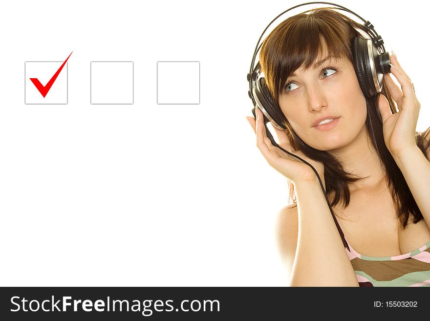 Marking in a Checkbox. Young woman with headphones makes a choice. Marking in a Checkbox. Young woman with headphones makes a choice