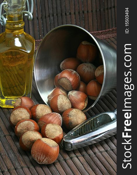 Basket of walnuts and hazelnuts after a walk in forest during autumn