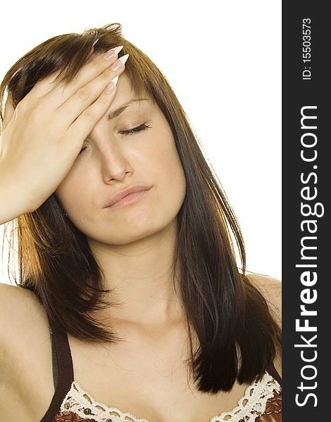 Young girl with a headache on white background