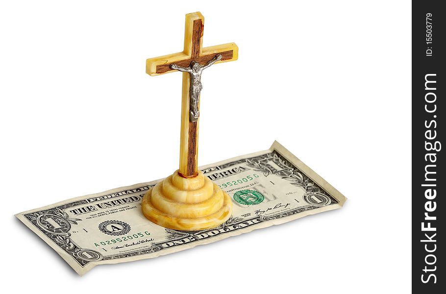 An amber cross over one dollar bill. An amber cross over one dollar bill