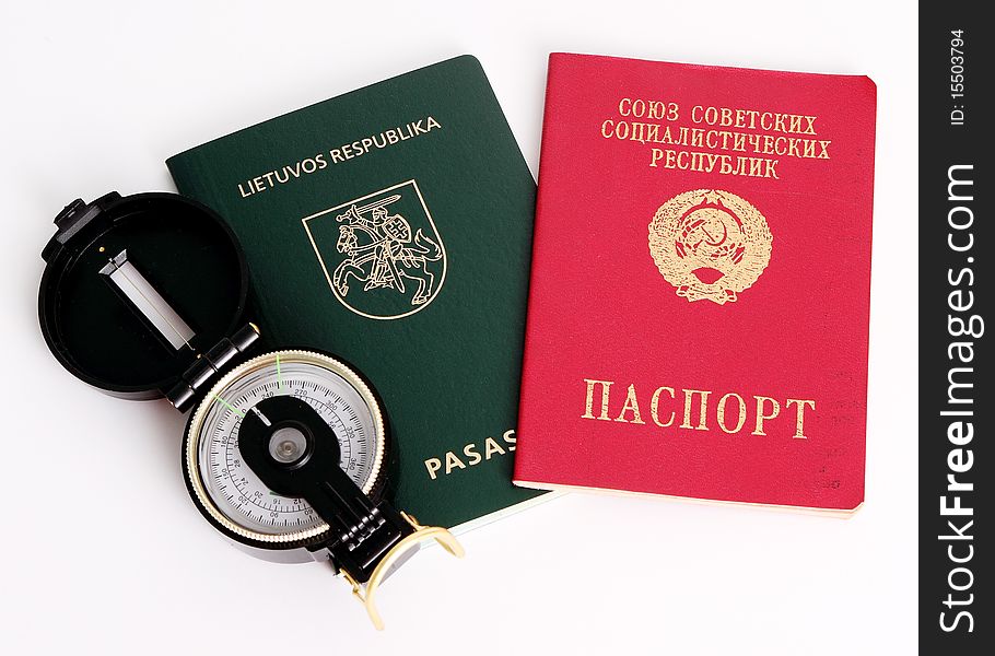 Soviet and Lithuanian passports with compass. Concept of immigration and traveling. Soviet and Lithuanian passports with compass. Concept of immigration and traveling.