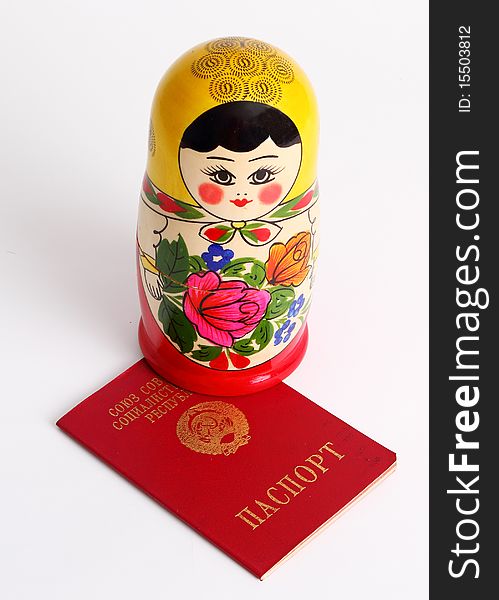 Russian Nesting Doll Standing On USSR Passport