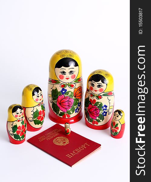 Matryoshka dolls family surrounding USSR passport