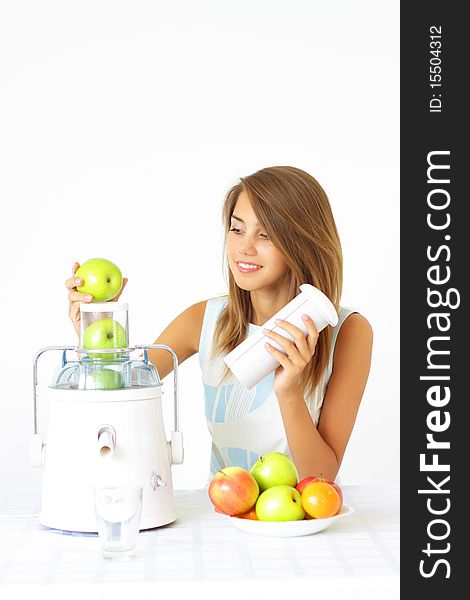 Happy girl about juicer on a light background. Happy girl about juicer on a light background