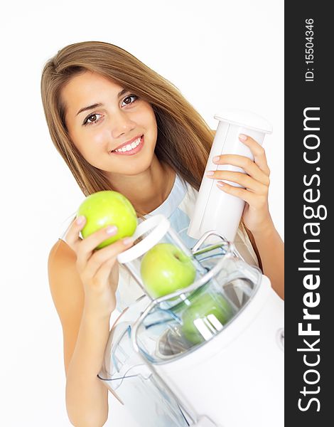 Happy girl about juicer on a light background