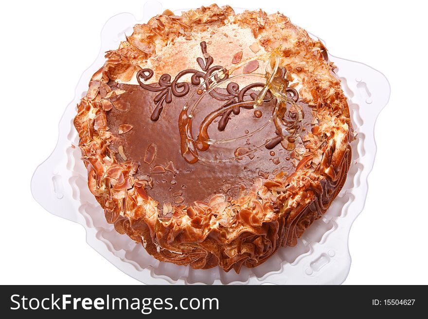 Torte on a white plastic plate. Isolated on a white background.