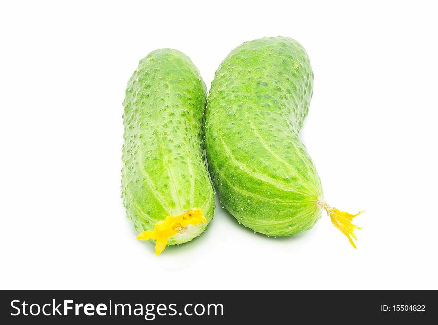 Two fresh green cucumbers isolated over white