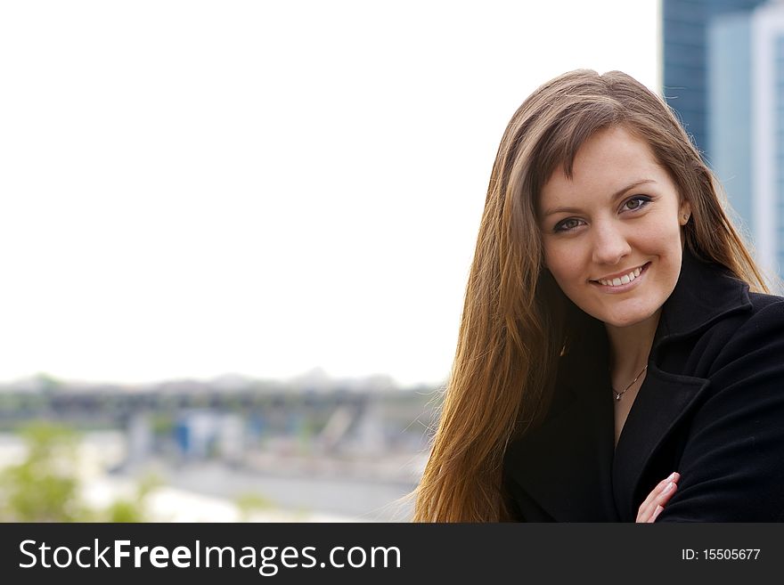 Portrait of nice girl on the background of the city