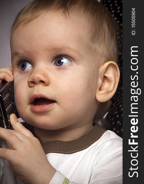 Little boy talking on mobile phone