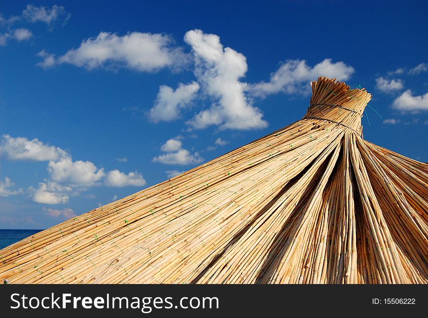 Straw Umbrella On A Beach In Montenegro