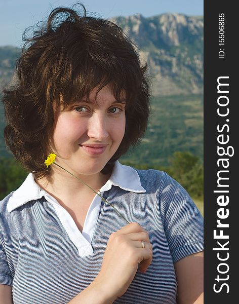 A young woman on the meadow