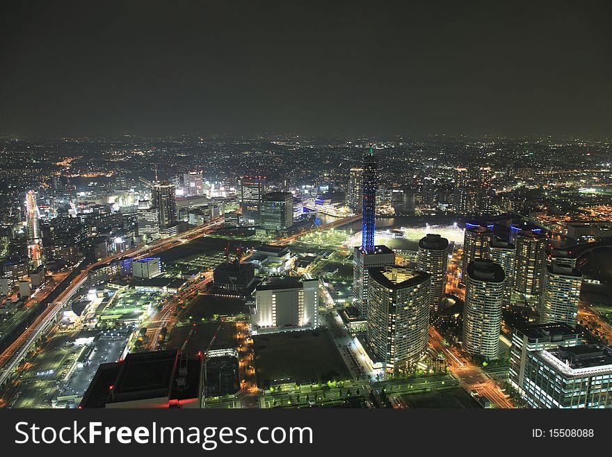 Osaka streets and skyscrapers at night from high above. Osaka streets and skyscrapers at night from high above