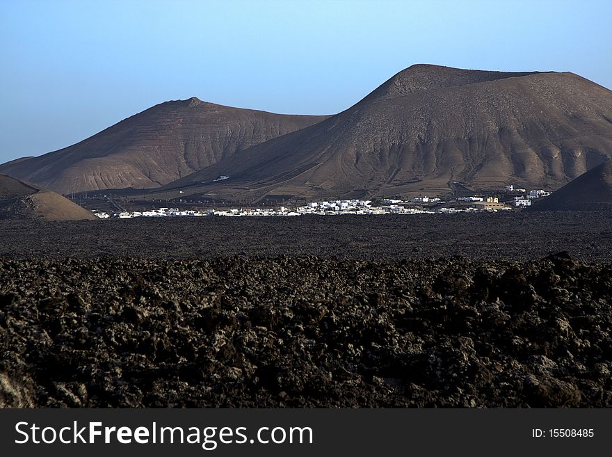 Village Yaiza seen from volcanic landscape