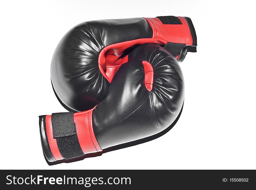 Red and black boxers gloves isolated on white background, lying next to each other