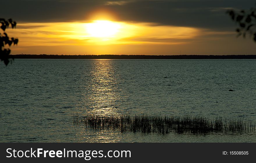 Sunset at the seaside viewed from the shore. Sunset at the seaside viewed from the shore