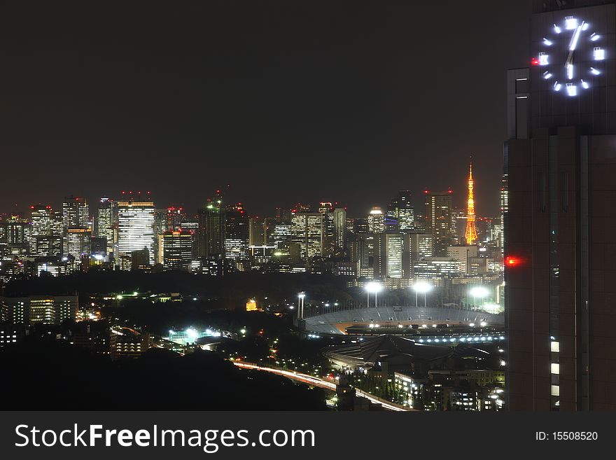 Tokyo streets, stadion and skyscrapers at night from high above. Tokyo streets, stadion and skyscrapers at night from high above