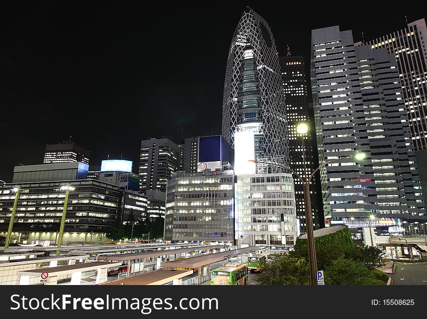 Tokyo streets, bus station and skyscrapers at night from high above. Tokyo streets, bus station and skyscrapers at night from high above