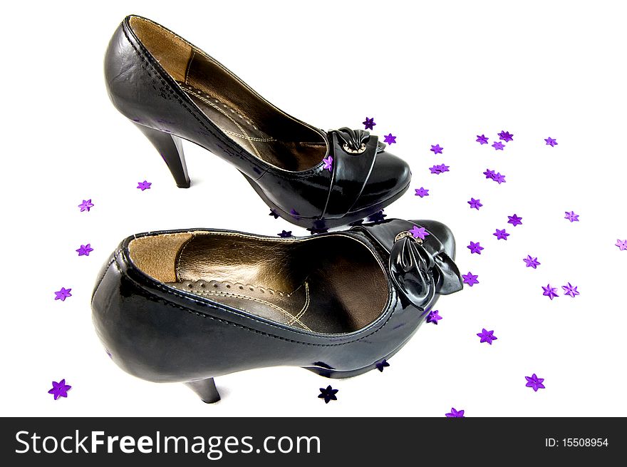 Black shoes with violet stars on white background. This is raster image.
