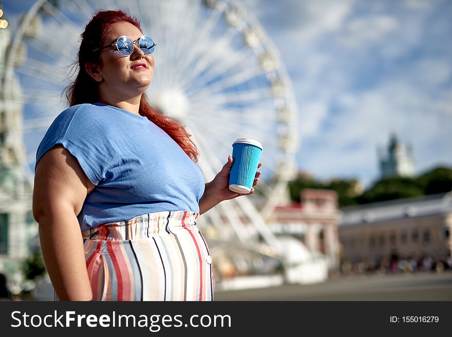 Fat And Young Woman Holding Coffee Cup In Hand