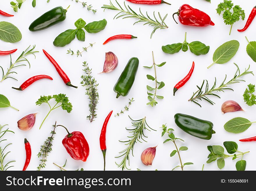 Spice herbal leaves and chili pepper on white background. Vegetables pattern. Floral and vegetables on white background. Top view, flat lay