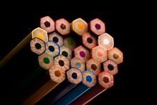 Wooden Pencils In All Colors Seen At The Base Of Pencils. Colored Pencils Stacked. With A Black Background.Colors. Back To School Stock Images