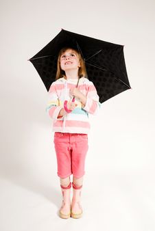 Lovely Little Girl Looking Up From Under Umbrella Royalty Free Stock Images Lovely Little Girl Looking Up From Under Umbrella Royalty Free Stock Images