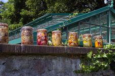 Colorful Jars In Kitchengarden. Royalty Free Stock Images Colorful Jars In Kitchengarden. Royalty Free Stock Images