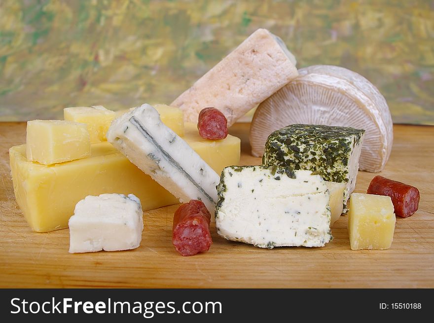 Cheese antipasto varieties on wooden chopping board