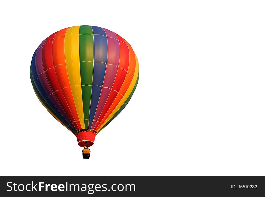 A rainbow colored hot air balloon isolated on white. A rainbow colored hot air balloon isolated on white