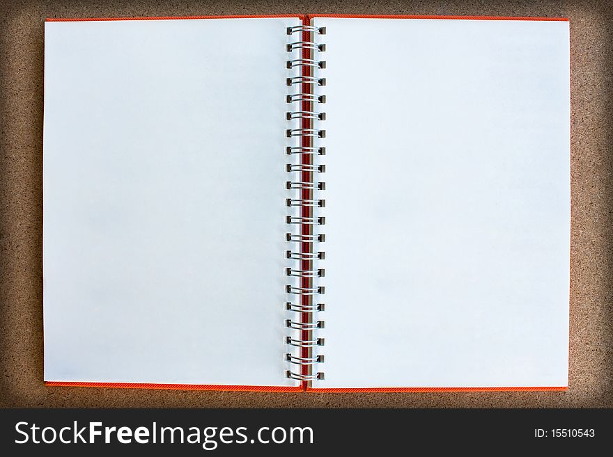 Blank twin face notebook on wood board