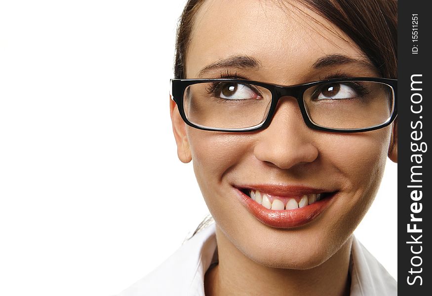 Cute young woman with spectacles smiles and looks upwards. Cute young woman with spectacles smiles and looks upwards