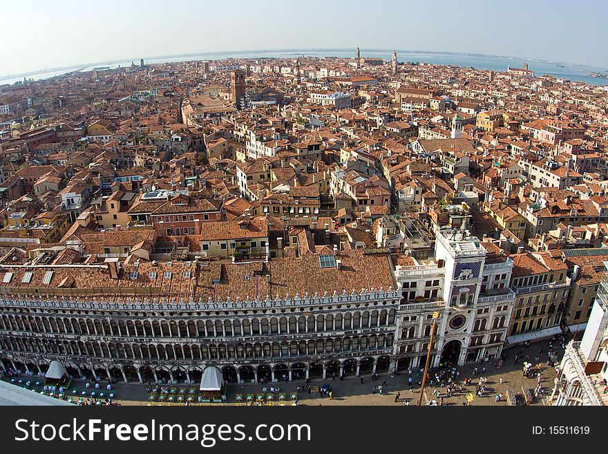 Overlooking the beautiful city and old palaces of venice with the laguna from the Markus tower