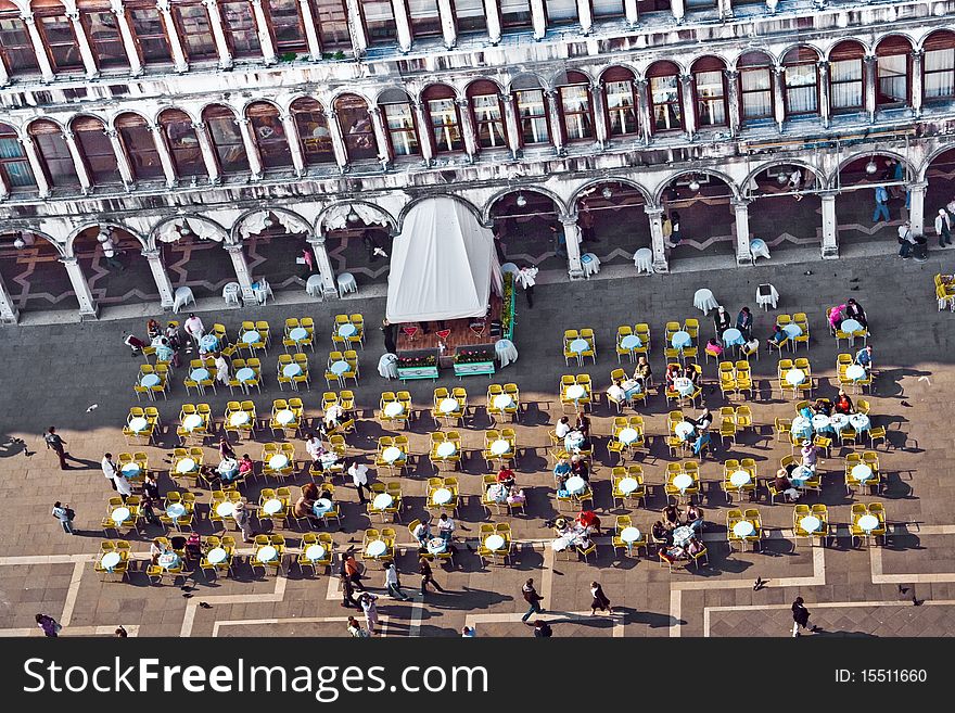 Venice, famous marcus place with cafe and tables with people seen from the marcus tower